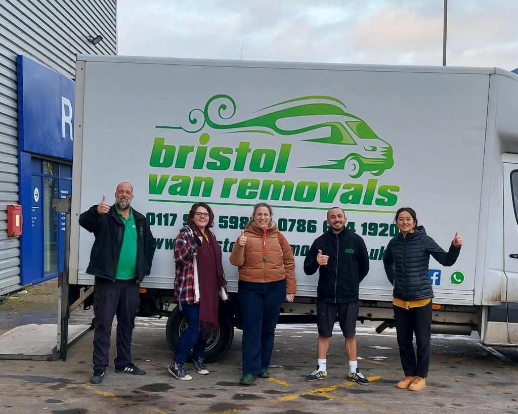 Some of the BVM team in front of a van, with thumbs up.
